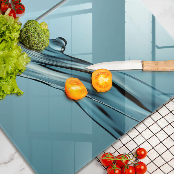 Tábua de vidro Água sobre fundo azul