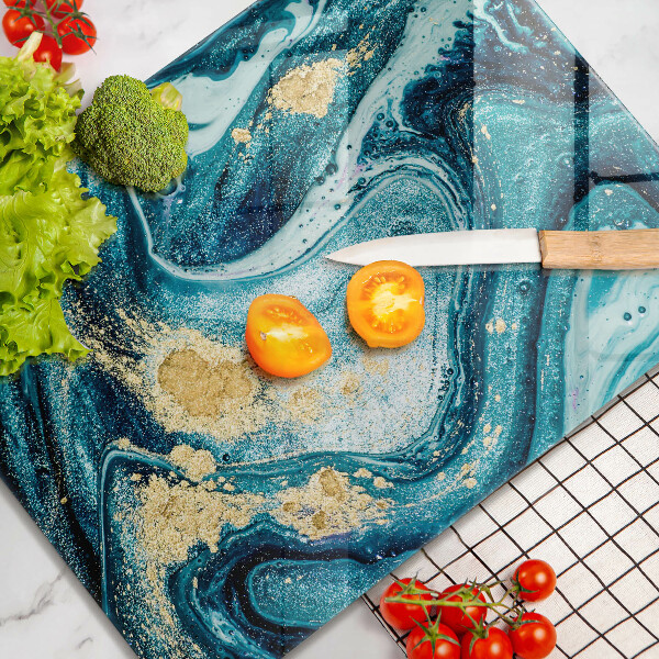 Tábua de cortar de vidro com estampa abstrata azul e dourado