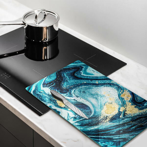 Tábua de cortar de vidro com estampa abstrata azul e dourado