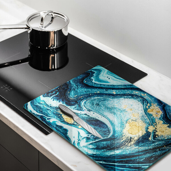 Tábua de cortar de vidro com estampa abstrata azul e dourado