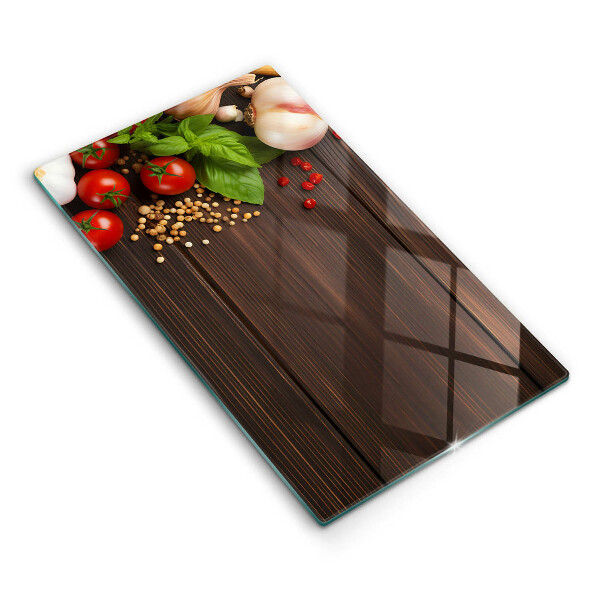 Tábua de corte de vidro decorada com vegetais
