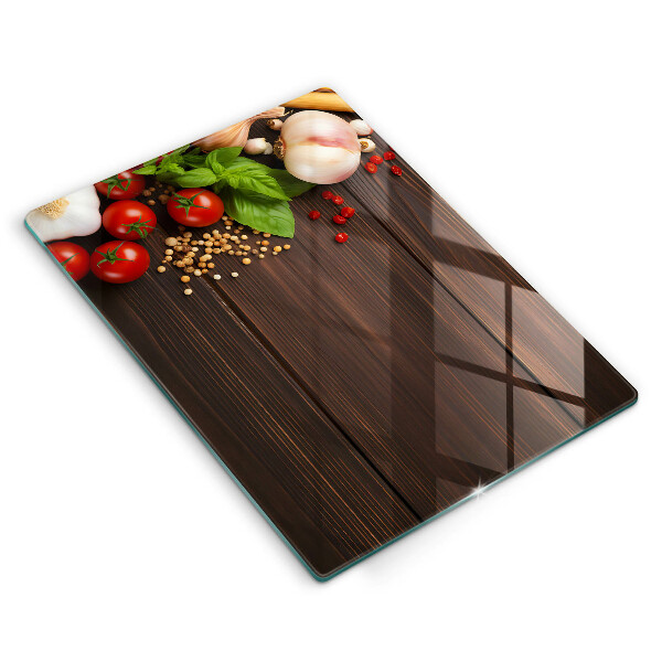 Tábua de corte de vidro decorada com vegetais