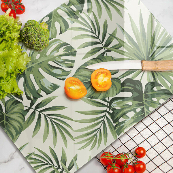 Tábua de vidro com ilustração de folhas de monstera