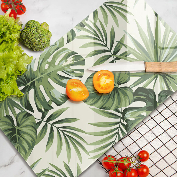 Tábua de vidro com ilustração de folhas de monstera