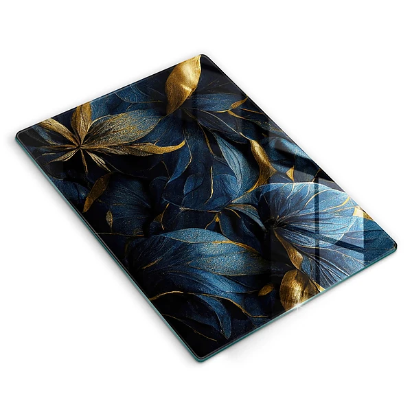 Tábua de corte com estampa de folhas decorativas e detalhes em ouro