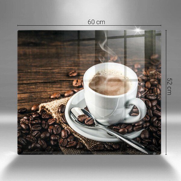 Tábua de cortar Uma xícara e grãos de café