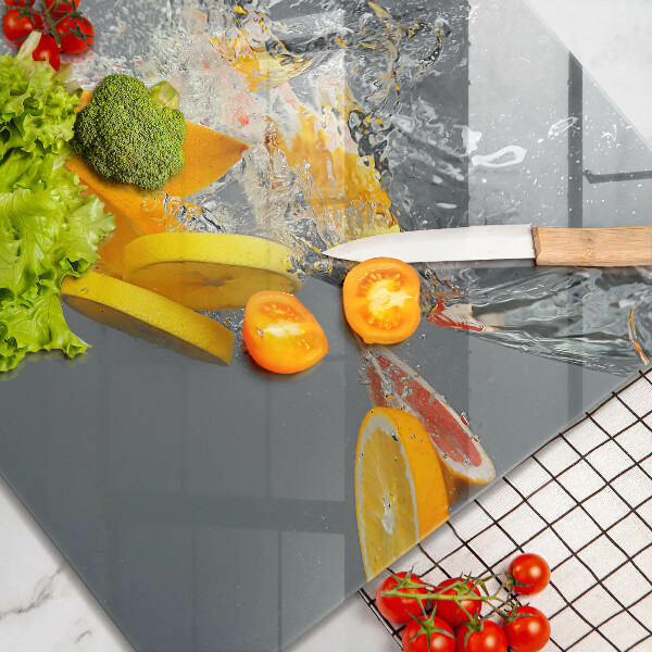 Tábua de cortar de vidro Limões em água