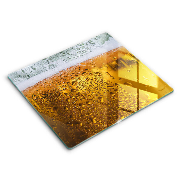 Tábua de cortar de vidro Um copo de cerveja molhado