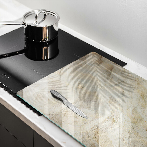 Tábua para corte Folhas de palmeira e areia