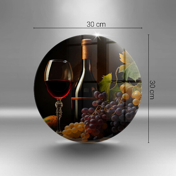 Tábua de corte de vidro Um copo de vinho e uvas