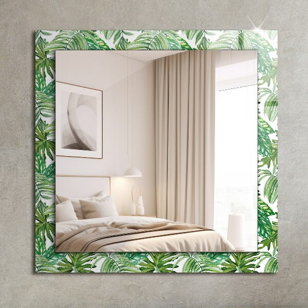 Espelho com moldura decorada com folhas verdes tropicais