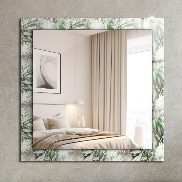 Espelho decorativo com desenho de folhas verdes
