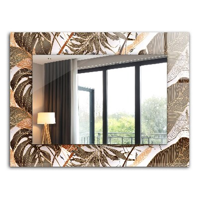 Espelho com moldura decorada com motivos de folhas tropicais