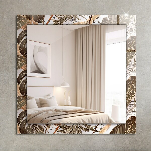 Espelho com moldura decorada com motivos de folhas tropicais