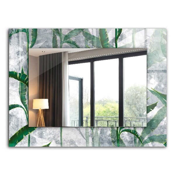 Espelho com moldura decorada de plantas com folhas verdes