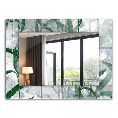 Espelho com moldura decorada de plantas com folhas verdes
