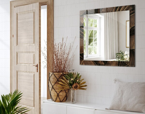 Espelho com moldura decorada com folhas tropicais