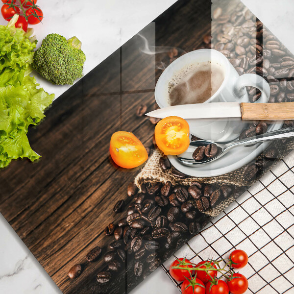 Cobertura de indução Uma xícara e grãos de café